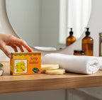 Box of Soap Sulfur on a bathroom shelf with a towel and bottles in the background