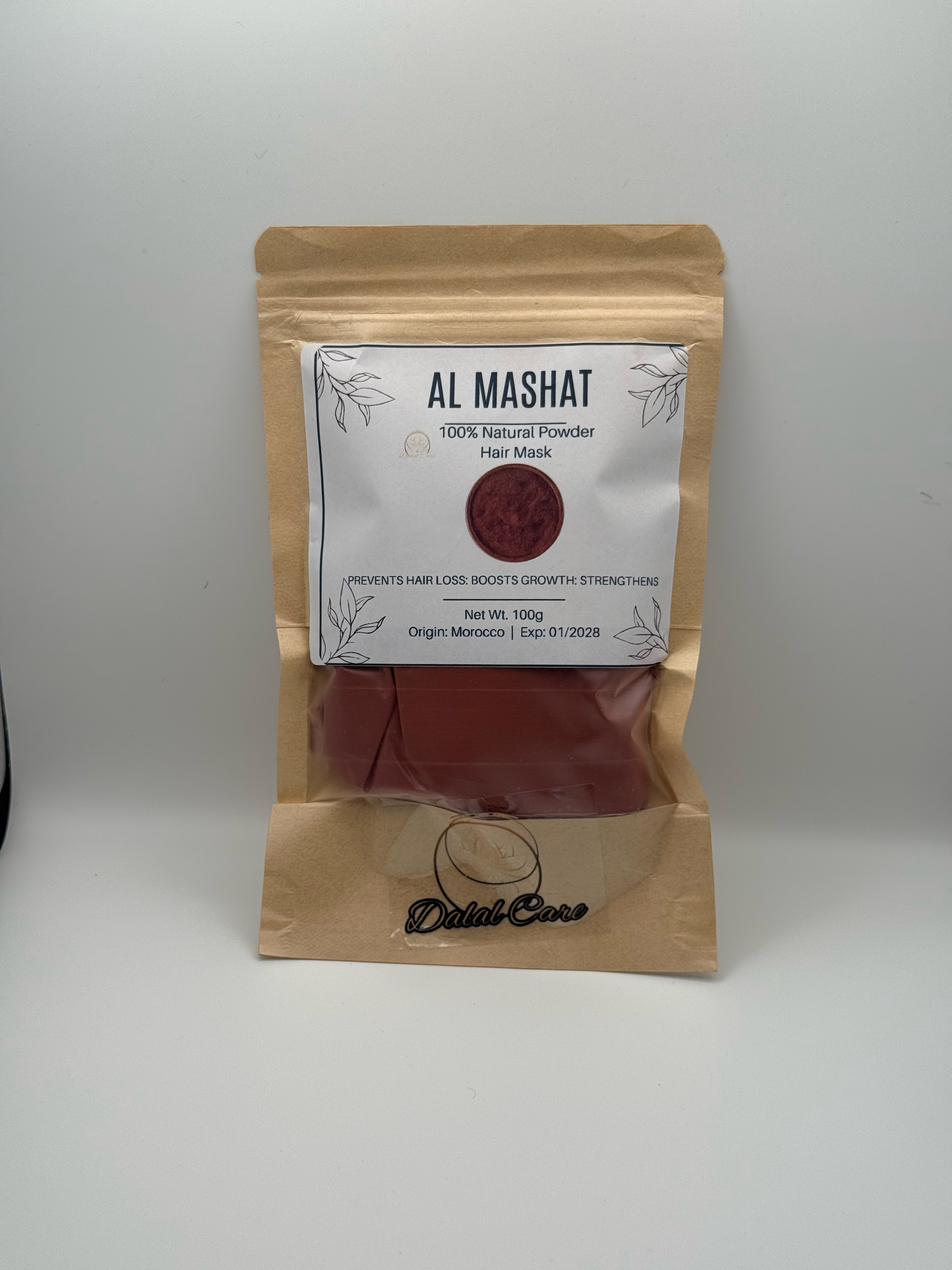 Bellanisa Al Mashat 100% Natural Powder Hair Mask in a brown resealable pouch. Reddish-brown powder visible.
