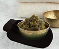 Bellanisa black deep exfoliating glove made from natural fiber for skin rejuvenation and exfoliation.